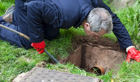 How can checking whether rooftop drains are covered with simple grilles reduce blockage problems
