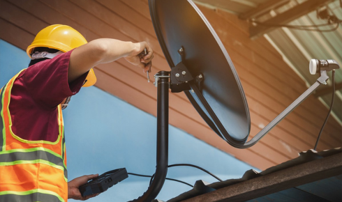 How can observing if satellite dishes and cables are fixed neatly instead of loosely tied show maintenance quality