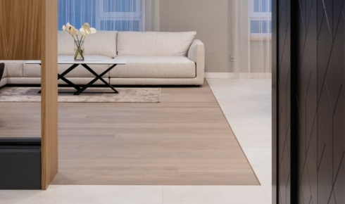 How can planning floor transitions carefully between rooms stop people from tripping