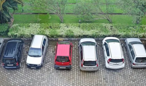 What can you learn by checking how clearly parking spots are marked and respected in the compound